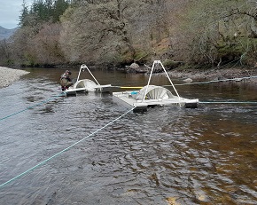 Rotary screw traps catching salmon smolts in the River Orchy